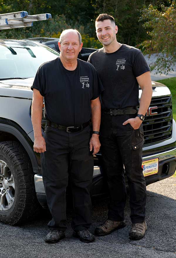 Dan and Tom Family owned Dan and Tom Family owned original image standing in front of truck - Rutland Chimney