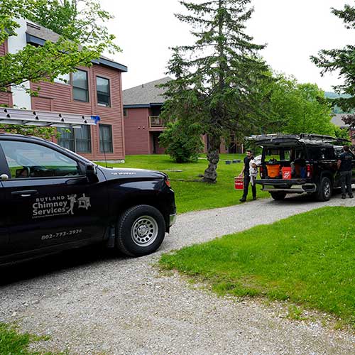 Rutland Chimney Trucks sitting in front of a home - original image - Rutland Chimney